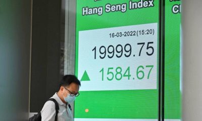 Asian shares rally after Fed raises rates