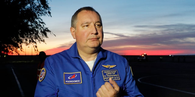 FILE - In this Thursday, Oct. 11, 2018 file photo, Director General of the Russia state corporation Roscosmos Dmitry Rogozin walks in Baikonur airport, in Kazakhstan. 