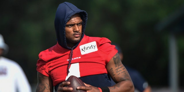 FILE- In an Aug. 2, 2021 file photo, Texans quarterback Deshaun Watson practices with the team during NFL football practice in Houston.