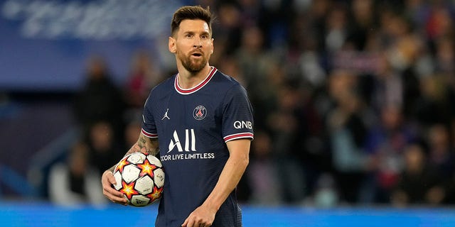 PSG's Lionel Messi prepares to take a penalty shot to score his side's third goal during a Champions League group A soccer match between Paris Saint Germain and RB Leipzig at the Parc des Princes stadium in Paris, Oct. 19, 2021. 