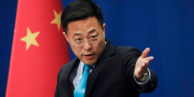 In this file photo taken Monday, Feb. 24, 2020, Chinese Foreign Ministry spokesperson Zhao Lijian speaks during a daily briefing at the Ministry of Foreign Affairs office in Beijing. 