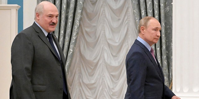 Russian President Vladimir Putin, right, and Belarusian President Alexander Lukashenko leave a joint news conference following their talks in the Kremlin in Moscow, Russia, Friday, Feb. 18, 2022. 