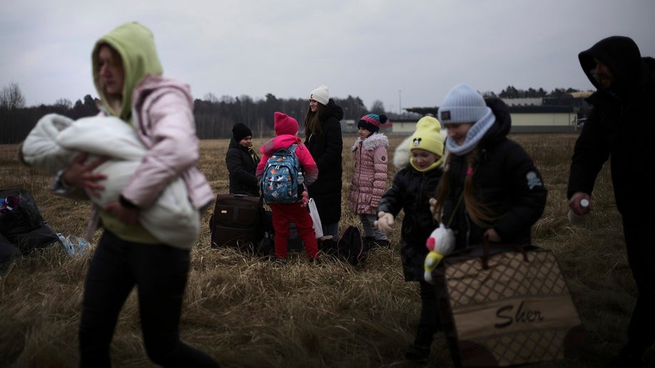 Ukrainian women and children fleeing country