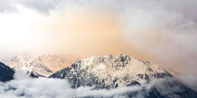 Dust from the Sahara desert can be seen above Le Catogne mountain as seen from Verbier, Switzerland.