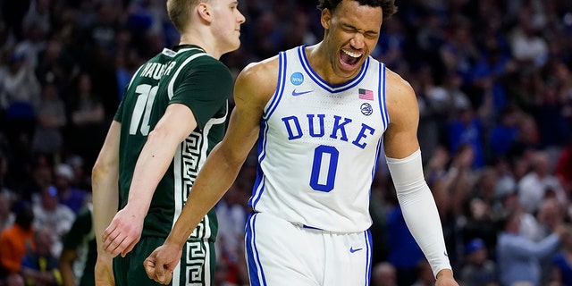 Duke forward Wendell Moore Jr. celebrates after their win as Michigan State forward Joey Hauser looks away during in a college basketball game in the second round of the NCAA tournament on Sunday, March 20, 2022, in Greenville, S.C.