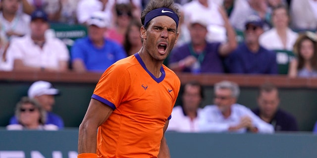 Rafael Nadal, of Spain, celebrates winning a point against Taylor Fritz during the men's singles finals at the BNP Paribas Open tennis tournament Sunday, March 20, 2022, in Indian Wells, Calif.