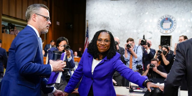 Supreme Court nominee Ketanji Brown Jackson departs with her husband Dr. Patrick Jackson, left, after the first day of her Senate Judiciary Committee confirmation hearing on Capitol Hill in Washington, Monday, March 21, 2022. (AP Photo/J. Scott Applewhite, Pool)