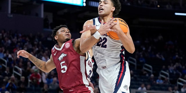 Gonzaga forward Anton Watson (22) grabs a rebound against Arkansas guard Au'Diese Toney (5) during the first half of a college basketball game in the Sweet 16 round of the NCAA tournament in San Francisco, Thursday, March 24, 2022.