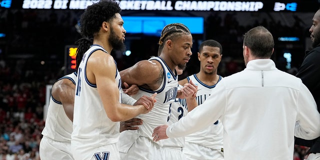 Villanova guard Justin Moore was later seen on crutches during the Wildcats' postgame celebration on Saturday, March 26, 2022, in San Antonio.