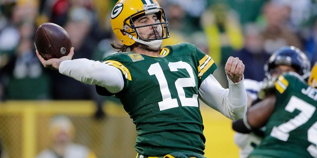 Green Bay Packers' Aaron Rodgers thorws during the first half of an NFL football game against the Seattle Seahawks Sunday, Nov. 14, 2021, in Green Bay, Wis.