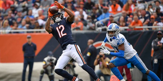 Oct 3, 2021; Chicago, Illinois, USA; Chicago Bears wide receiver Allen Robinson (12) catches the ball for a first down in the second half against Detroit Lions defensive back Bobby Price (27) at Soldier Field. 