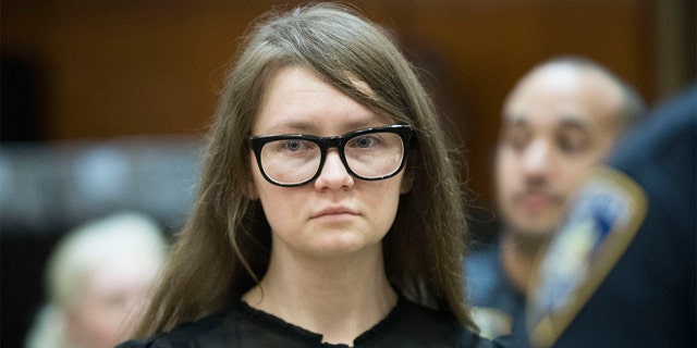 In this April 25, 2019, file photo, Anna Sorokin, who claimed to be a German heiress, returns to the courtroom during her trial on grand larceny and theft of services charges in New York.    A state website shows that Sorokin was freed into parole on Thursday, Feb. 11, 2021. A Manhattan jury found Sorokin guilty in 2019 of grand larceny and other charges accusing her of tricking people into believing she was an heiress with a fortune of about $67 million. 