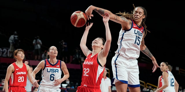 Japan's Saori Miyazaki (32), center, is blocked by United States' Brittney Griner (15), second right, during women's basketball preliminary round game at the 2020 Summer Olympics, Friday, July 30, 2021, in Saitama, Japan. (AP Photo/Eric Gay)