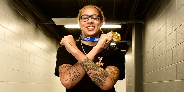 Brittney Griner of the Phoenix Mercury arrives with her gold medal from the 2020 Tokyo Olympics before the game against the Atlanta Dream on Aug. 15, 2021 at Footprint Center in Phoenix, Arizona.