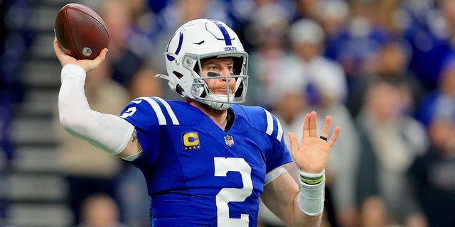 Indianapolis Colts quarterback Carson Wentz throws during the first half of an NFL football game against the New England Patriots Saturday, Dec. 18, 2021, in Indianapolis. 