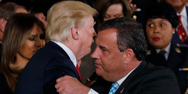 FILE - President Trump greets New Jersey Gov. Chris Christie after speaking about administration plans to combat the nation's opioid crisis in the East Room of the White House in Washington, Oct. 26, 2017 REUTERS/Carlos Barria