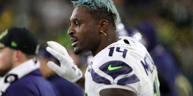 DK Metcalf #14 of the Seattle Seahawks reacts against the Green Bay Packers during the second half at Lambeau Field on November 14, 2021 in Green Bay, Wisconsin.