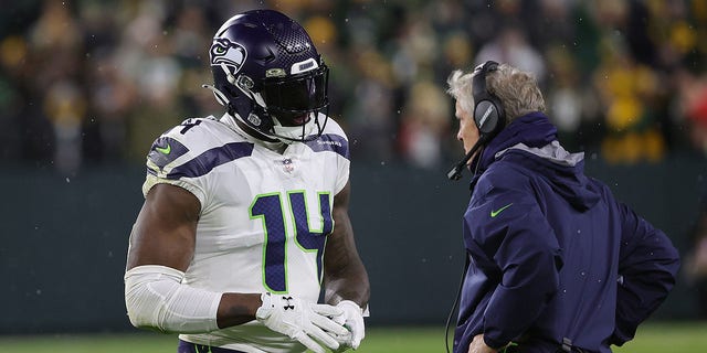 DK Metcalf #14 of the Seattle Seahawks is ejected from the game following an altercation during a game against the Green Bay Packers at Lambeau Field on November 14, 2021 in Green Bay, Wisconsin.  The Packers defeated the Seahawks 17-0. 