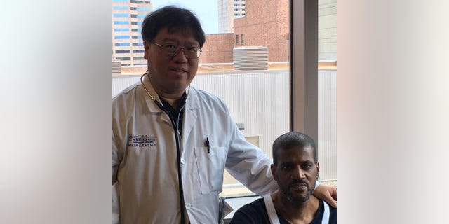 Donald Crigler (right, seated) and Dr. Andrew Kao are pictured here. Kao, the medical director of heart transplantation at Saint Luke’s Mid America Heart Institute, was the doctor for Donald and Ronald. 