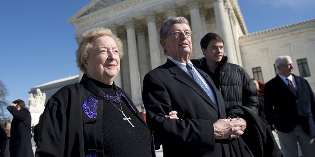 Anti-abortion protestor Eleanor McCullen of Newton, Massachusetts, and her attorney, Philip Moran, stand outside the U.S. Supreme Court following oral arguments in the case of McCullen v. Coakley Jan. 15, 2014.