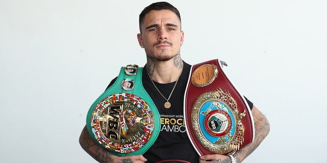 Australian WBA, WBO &amp; IBF Lightweight World Champion boxer George Kambosos poses at Sydney Airport on December 09, 2021 in Sydney, Australia.