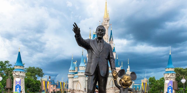 ORLANDO, FLORIDA, UNITED STATES - 2019/07/17: Walt Disney and Mickey Mouse statue inside of the Magic Kingdom theme park . The Cinderella castle can be seen in the background. (Photo by Roberto Machado Noa/LightRocket via Getty Images)