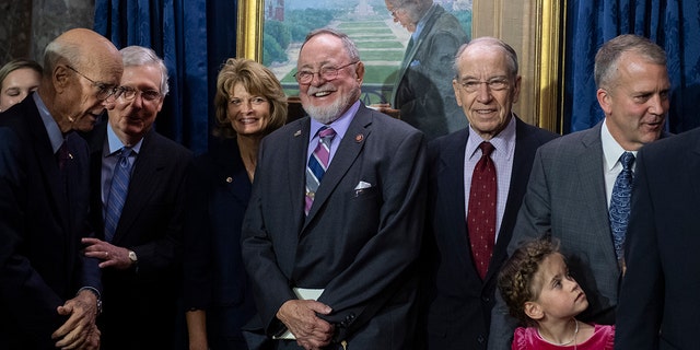 Rep. Don Young and his colleagues are seen during the portrait unveiling for the late Sen. Ted Stevens, R-Alaska, in the Old Senate Chamber on October 23, 2019.