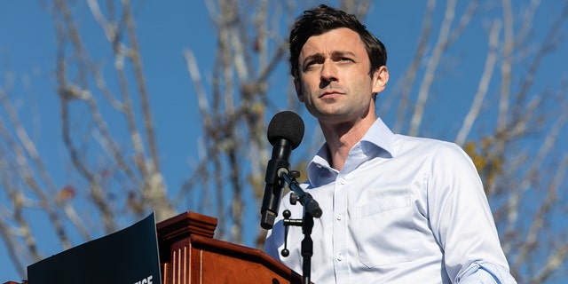 Sen. Jon Ossoff, D-Ga., then a candidate for Senate, speaks to the crowd during an outdoor drive-in rally on Dec. 5, 2020 in Conyers, Georgia. 