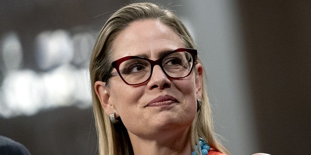 Senator Kyrsten Sinema, a Democrat from Arizona, listens during a news conference in the Dirksen Senate Office Building in Washington, D.C., U.S., on Wednesday, July 28, 2021.