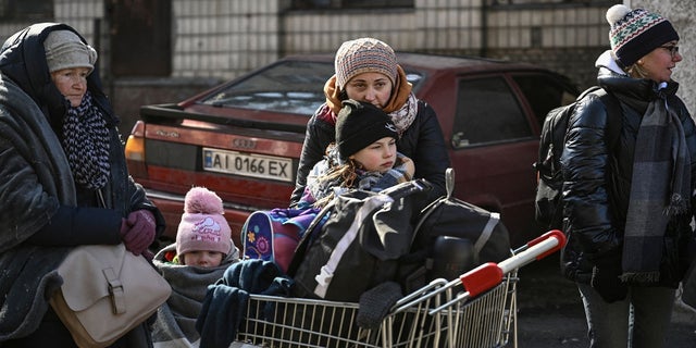 Residents wait to be evacuated from the city of Irpin, north of Kyiv, on March 10, 2022. 