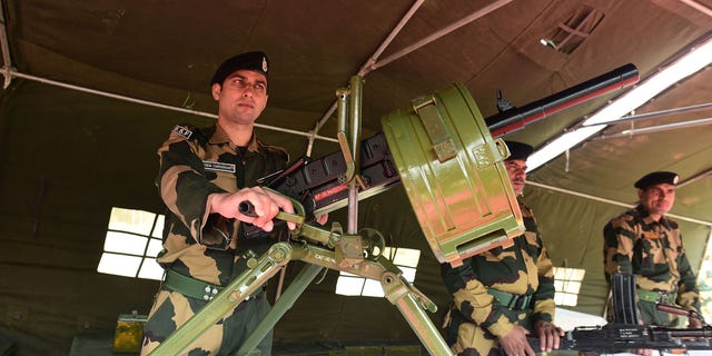 Border Security Force (BSF) personnel display weapons during an exhibition as a part of Azadi ka Amrit Mahotsav programme, on March 10, 2022 in Srinagar, India. (Waseem Andrabi/Hindustan Times via Getty Images)