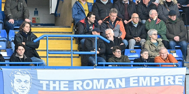 A banner depicting Chelsea's Russian owner Roman Abramovich is seen in the stands during the English Premier League football match between Chelsea and Newcastle United in London on March 13, 2022.