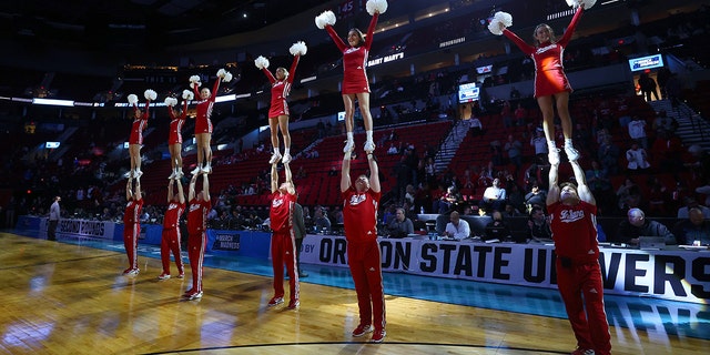 The Indiana Hoosiers cheerleaders perform against the Saint Mary's Gaels during the first round of the 2022 NCAA Men's Basketball Tournament held at the Moda Center on March 17, 2022 in Portland, Oregon. 