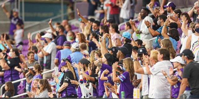 Fans celebrate the Orlando Pride win after the home game at Exploria Stadium against Kansas City on May 30, 2021, in Orlando, Florida.