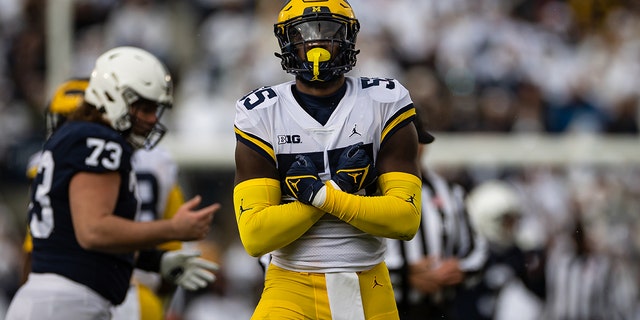  David Ojabo #55 of the Michigan Wolverines celebrates after recording a sack against the Penn State Nittany Lions during the first half at Beaver Stadium on November 13, 2021 in State College, Pennsylvania. 