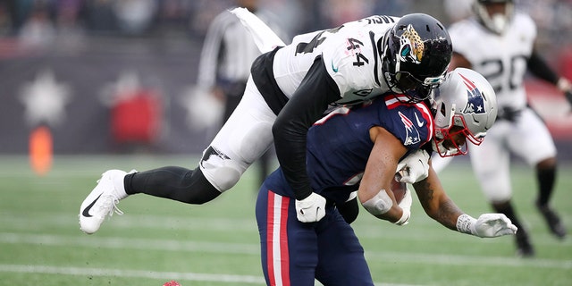 Myles Jack #44 of the Jacksonville Jaguars tackles Jakobi Meyers #16 of the New England Patriots in the third quarter of the game at Gillette Stadium on January 02, 2022 in Foxborough, Massachusetts. 