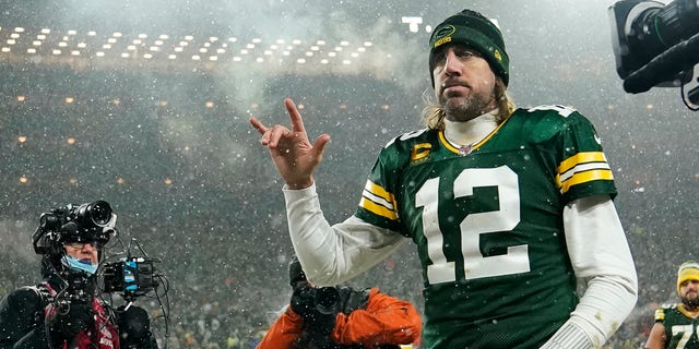 Quarterback Aaron Rodgers #12 of the Green Bay Packers gestures as he exits the field after losing the NFC Divisional Playoff game to the San Francisco 49ers at Lambeau Field on Jan. 22, 2022 in Green Bay, Wisconsin. 