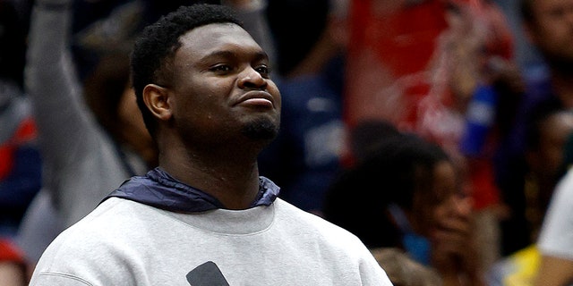 Zion Williamson #1 of the New Orleans Pelicans stands next to the bench during the third quarter of an NBA game against the Phoenix Suns at Smoothie King Center on March 15, 2022, in New Orleans, Louisiana.