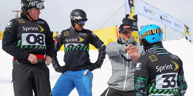 (L-R) Nate Holland, J.J. Tomlinson, Peter Foley, U.S. Snowboarding Head Coach, and Graham Watanabe discuss the course during training prior to snowboard cross qualification during the Sprint U.S. Grand Prix at The Canyons Ski Resort on February 10, 2012 in Park City, Utah. 