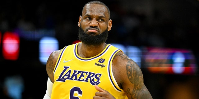 LeBron James #6 of the Los Angeles Lakers celebrates during the fourth quarter against the Cleveland Cavaliers at Rocket Mortgage Fieldhouse on March 21, 2022, in Cleveland, Ohio.