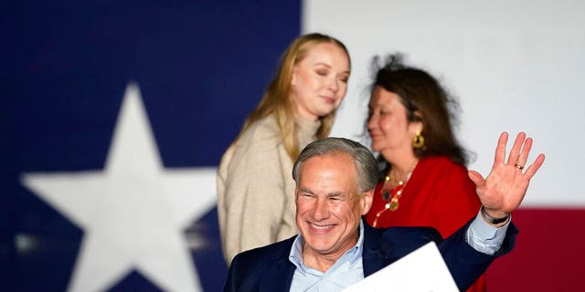 Texas Gov. Greg Abbott, with his wife Cecilia, right, and daughter Audrey, left, arrives for a primary election night event, Tuesday, March 1, 2022, in Corpus Christi, Texas. (AP Photo/Eric Gay)