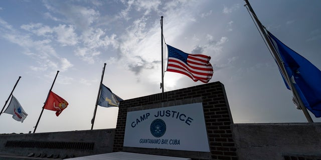 Flags fly at half-staff at Camp Justice at Guantanamo Bay Naval Base, Cuba, in honor of the U.S. service members and other victims killed in the terrorist attack in Kabul, Afghanistan,
