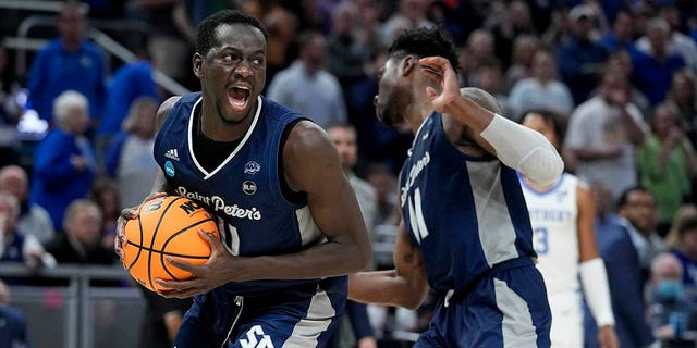 Saint Peter's forward Hassan Drame celebrates after grabbing a rebound during overtime in a college basketball game against Kentucky in the first round of the NCAA tournament, Thursday, March 17, 2022, in Indianapolis. Saint Peter's won 85-79.