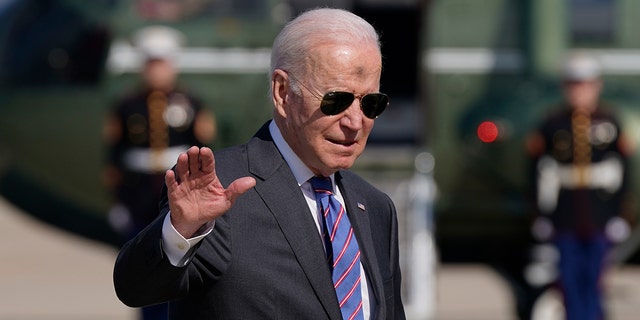 President Biden waves as he and first lady Jill Biden board Air Force One, Wednesday, March 2, 2022, at Andrews Air Force Base, Md. (AP Photo/Patrick Semansky)