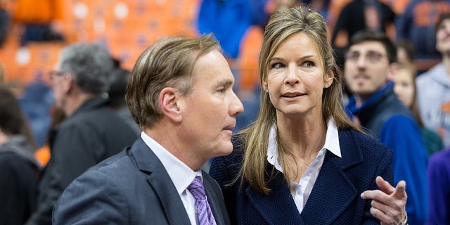 Juli Boeheim, wife of Jim Boeheim, speaks with a member of the ESPNU broadcast team following a basketball game between the Syracuse Orange and the Hampton Pirates on November 16, 2014 at The Carrier Dome in Syracuse, New York.  Syracuse defeated Hampton 65-47. 