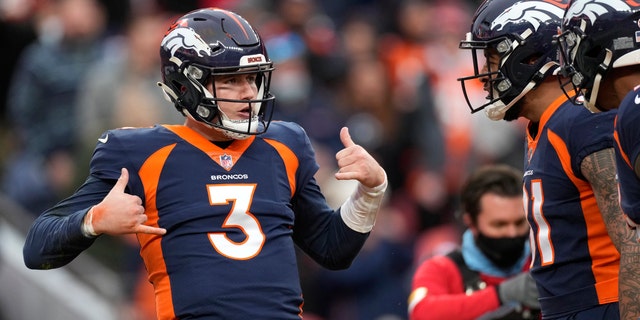 Denver Broncos quarterback Drew Lock (3) celebrates with teammates after scoring against the Kansas City Chiefs during the first half of an NFL football game Saturday, Jan. 8, 2022, in Denver. 