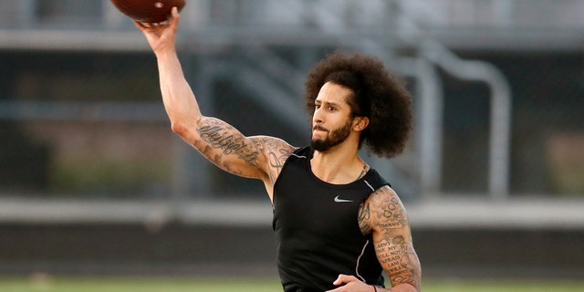 Free agent Colin Kaepernick participates in a workout for NFL football scouts and media Saturday, Nov. 16, 2019 in Riverdale, Ga. (AP Photo/Todd Kirkland)