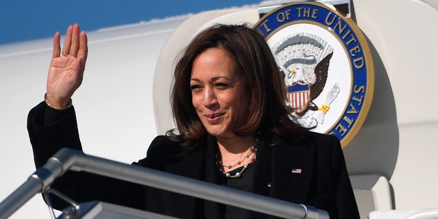 Harris waves as she boards the Air Force Two prior to departing for Romania, at Warsaw Chopin International Airport, in Warsaw, Poland, Friday, March 11, 2022. 