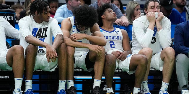 Kentucky players react on the bench at the end of a college basketball game against Saint Peter's in the first round of the NCAA tournament, Thursday, March 17, 2022, in Indianapolis. Saint Peter's won 85-79 in overtime.