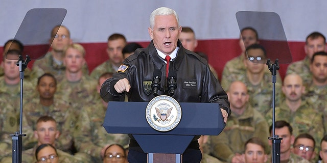 Former U.S. Vice President Mike Pence speaks to troops in a hangar at Bagram Air Field in Afghanistan on December 21, 2017.